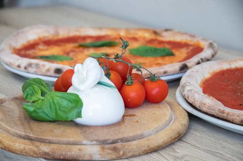 Elegant catering setup with pizza and appetizers