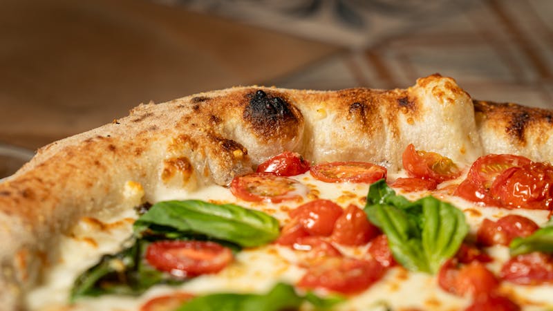 Margherita pizza with fresh basil and mozzarella